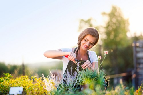Gardener practicing sustainable gardening techniques